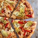 Vegan artichoke and red bell pepper pizza