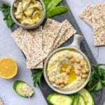 Artichoke hummus served with crackers and vegetables