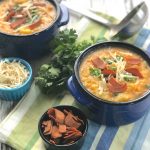 Two-potato soupd with vegan bacon and vegan cheese