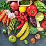 Colorful fruits and vegetables in a shopping bag