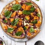 Vegan Sweet potato pizza with onions, olives, & spinach