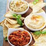 Mediterranean Mezze with eggplant and tomato spread, hummus, and baba ghanouj