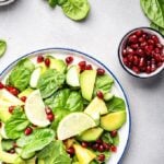 spinach avocado salad with pineapple and pomegranate seeds