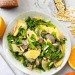 Citrus braised mustard greens with apple and nuts