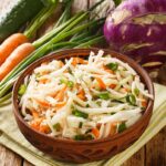 Kohlrabi salad with carrots and cucumbers