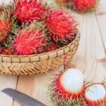 Rambutan in a basket and cut open