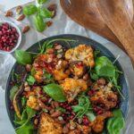 Roasted Cauliflower pomegranate salad with baby arugula and almonds