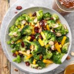 Broccoli cranberry salad with yellow bell peppers and almonds