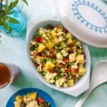 Cauliflower and potato salad with olives and peas