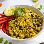 Coconut Yellow Rice and Black Beans in a bowl