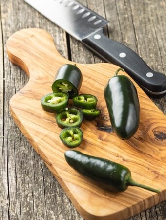 Sliced jalapeno pepper on cutting board