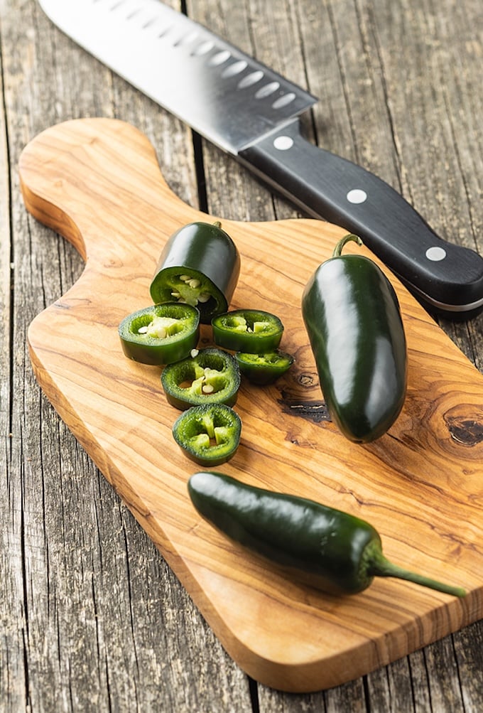 Sliced jalapeno pepper on cutting board