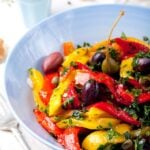 Roasted yellow and red bell peppers with black olives