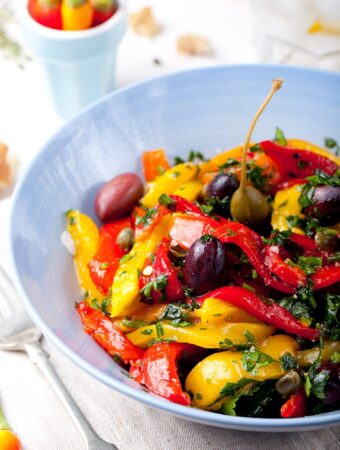 Roasted yellow and red bell peppers with black olives